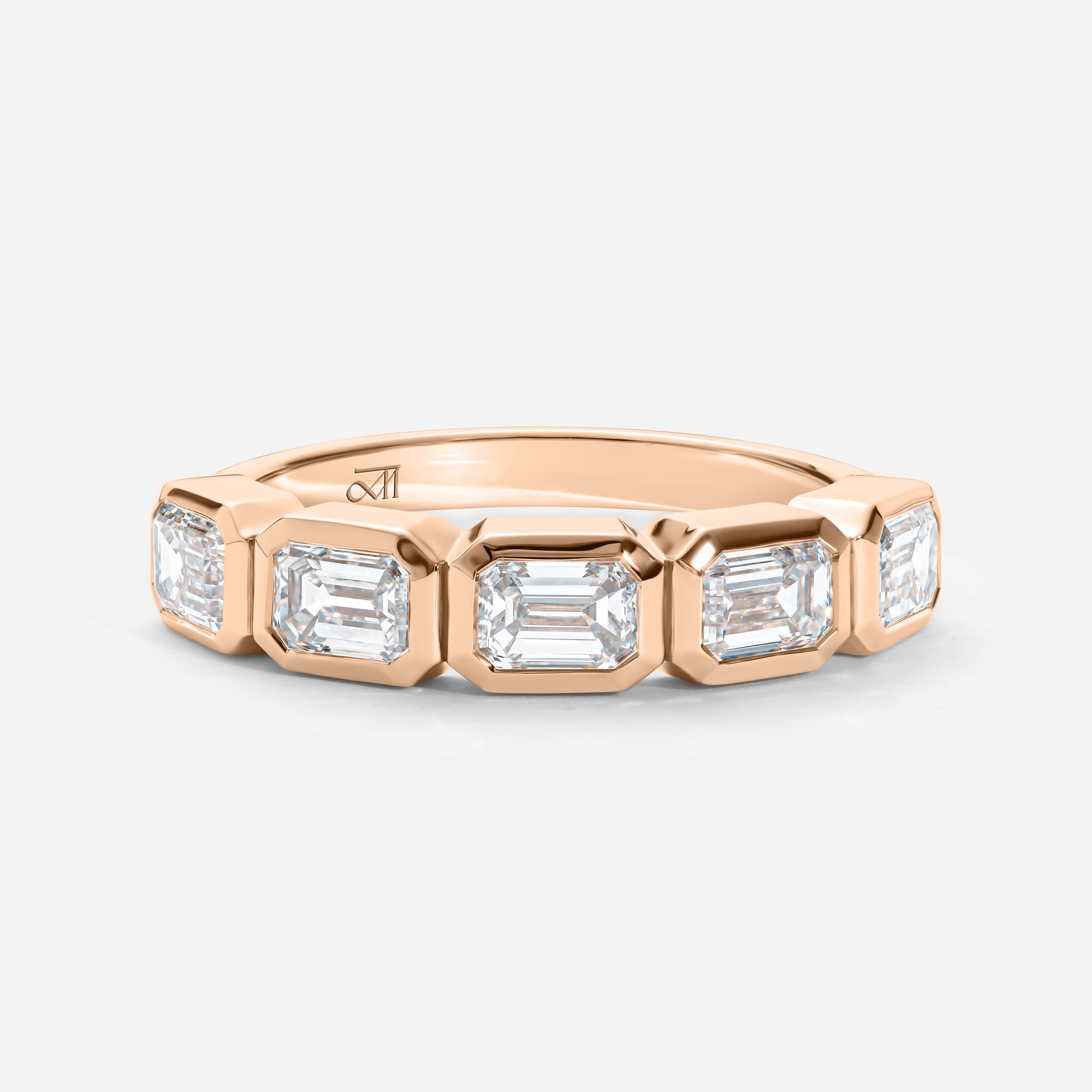 Five East-West Emerald Bezel Ring