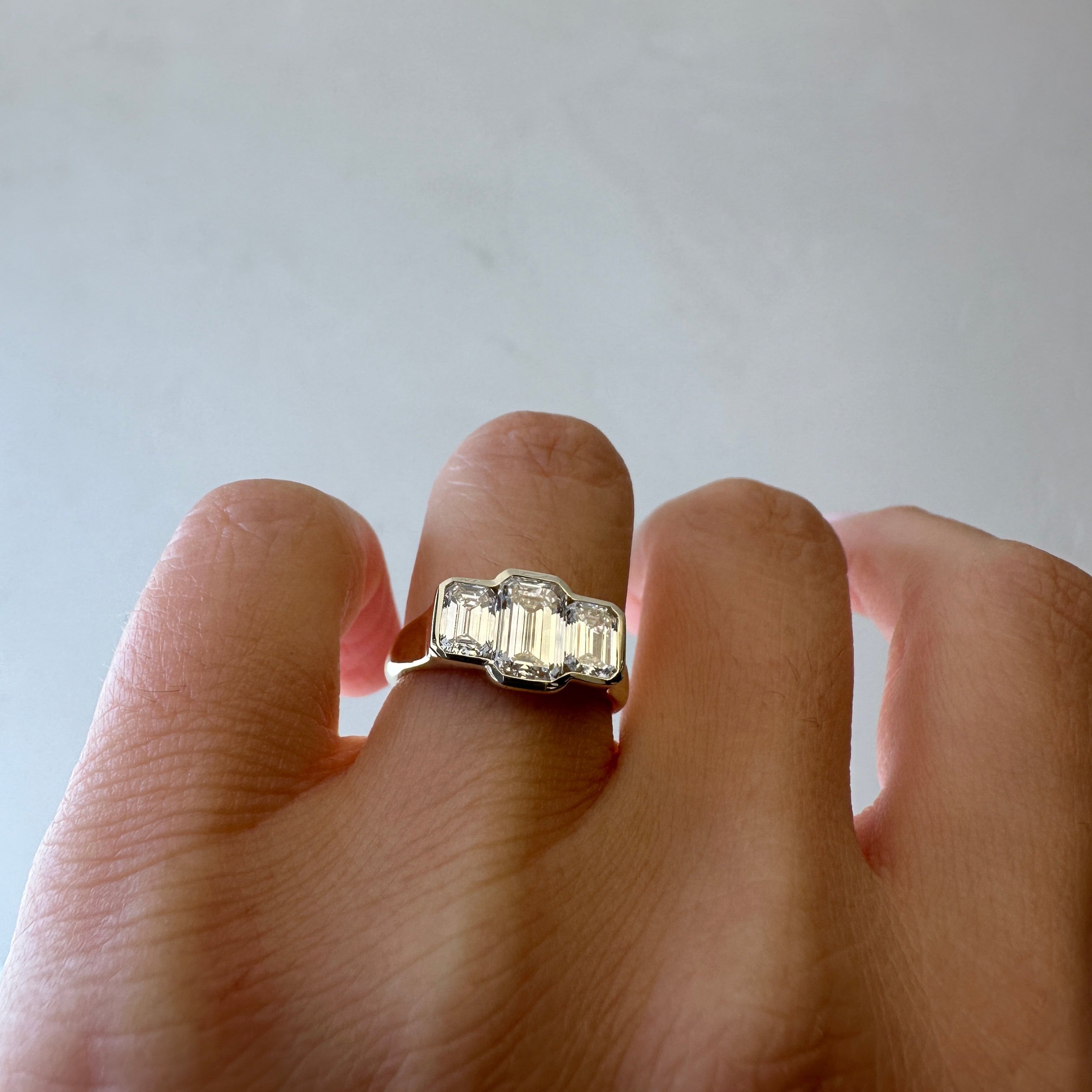 Three Stone Emerald Bezel | L