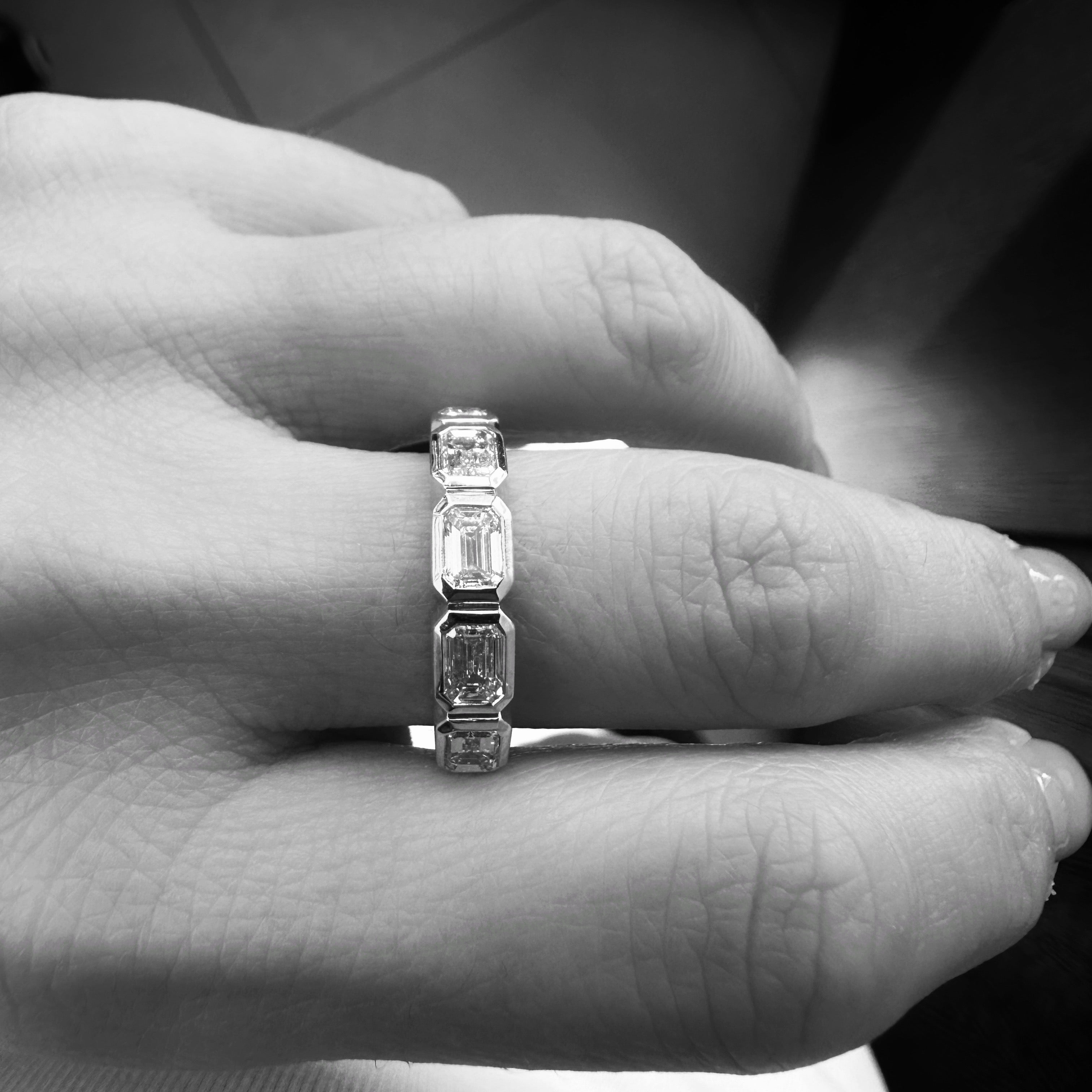 Five East-West Emerald Bezel Ring