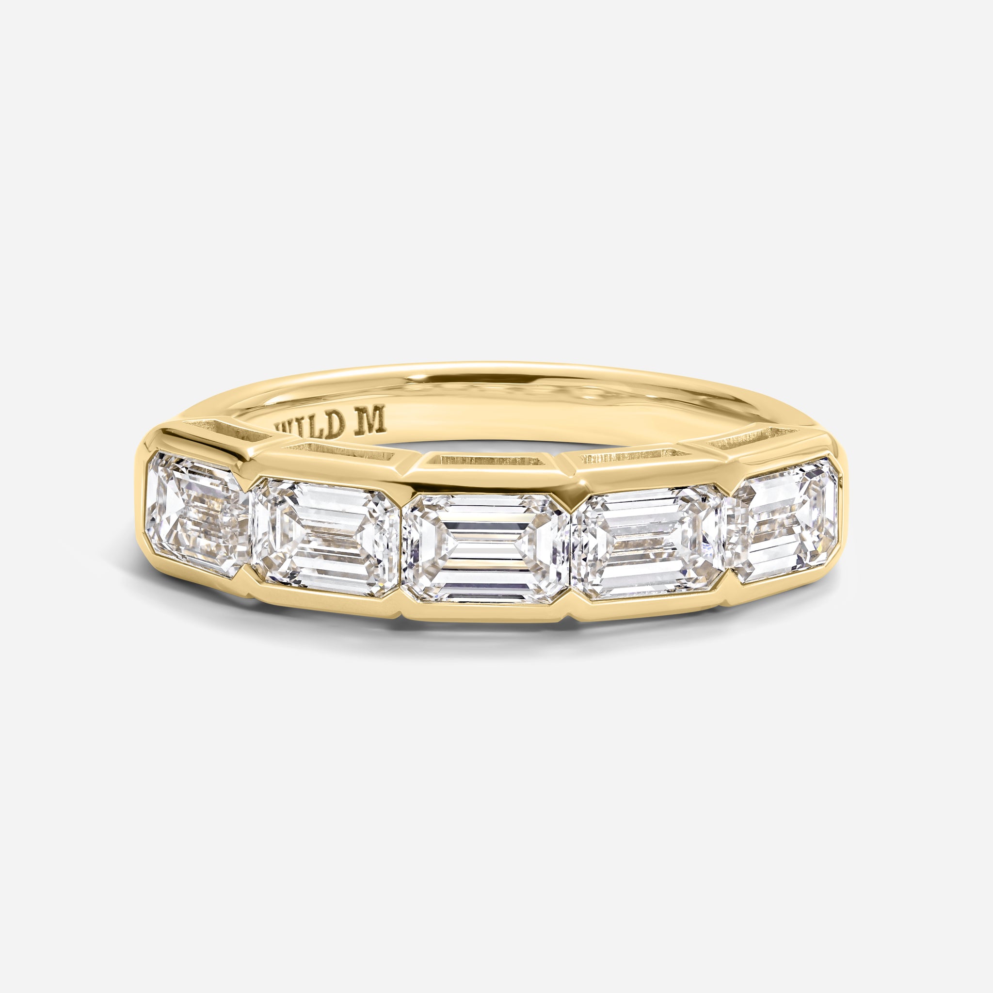Five East-West Emerald Bezel Ring